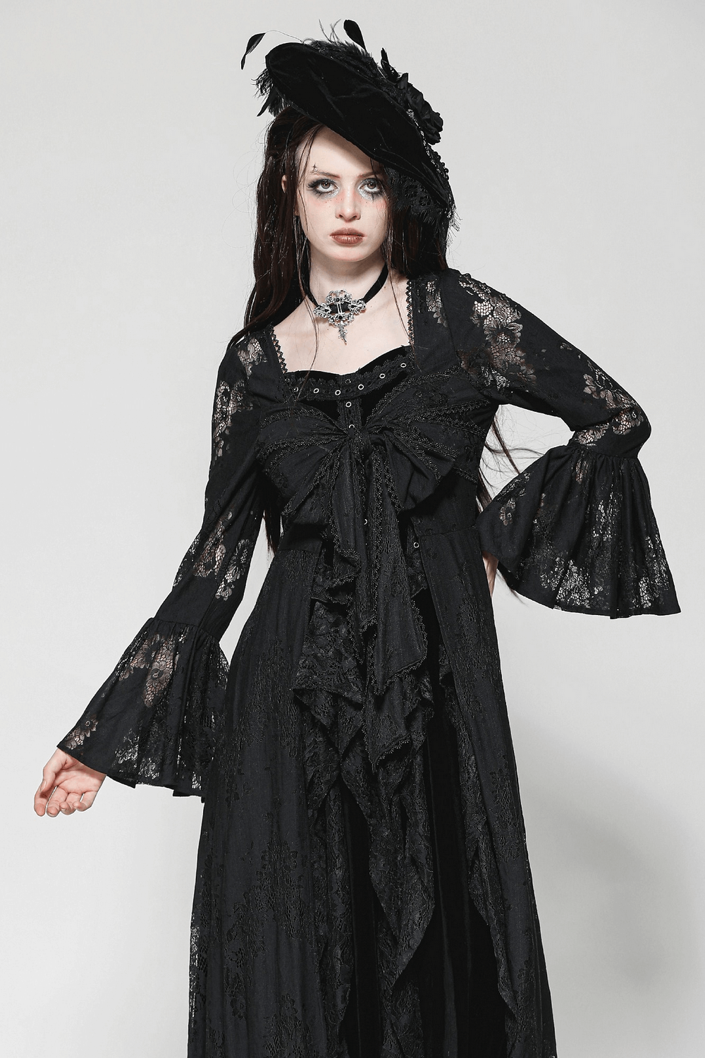 Elegant gothic lace cape with bell sleeves and floral design, perfect for alternative fashion and special occasions.