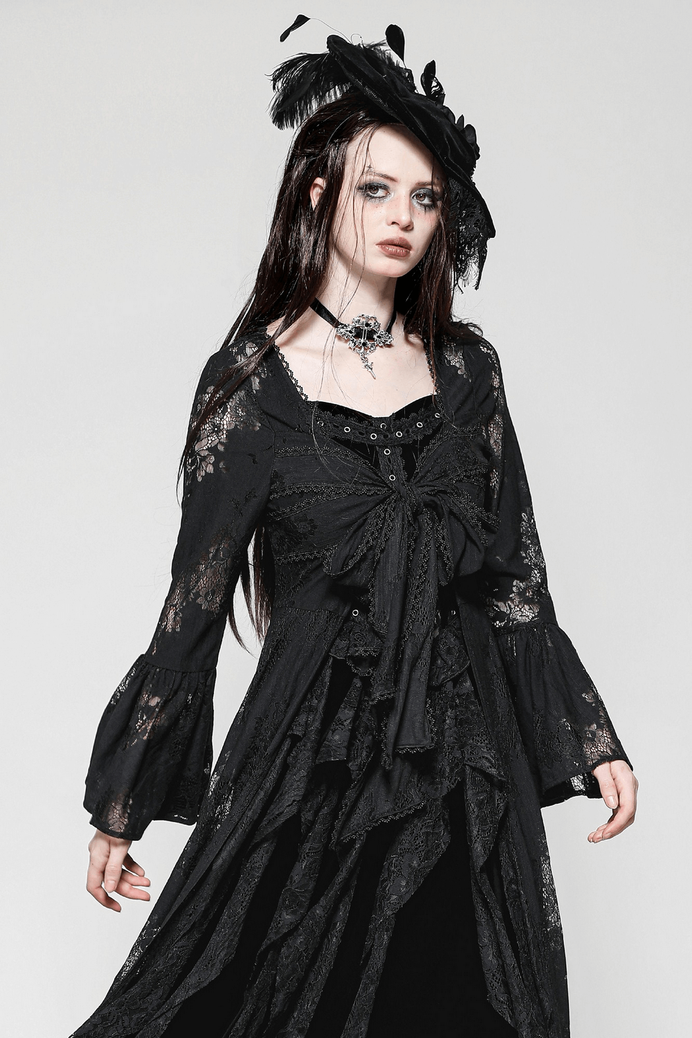 Elegant lace long-sleeved cape with bell sleeves, floral details, and a bow tie, perfect for gothic fashion.
