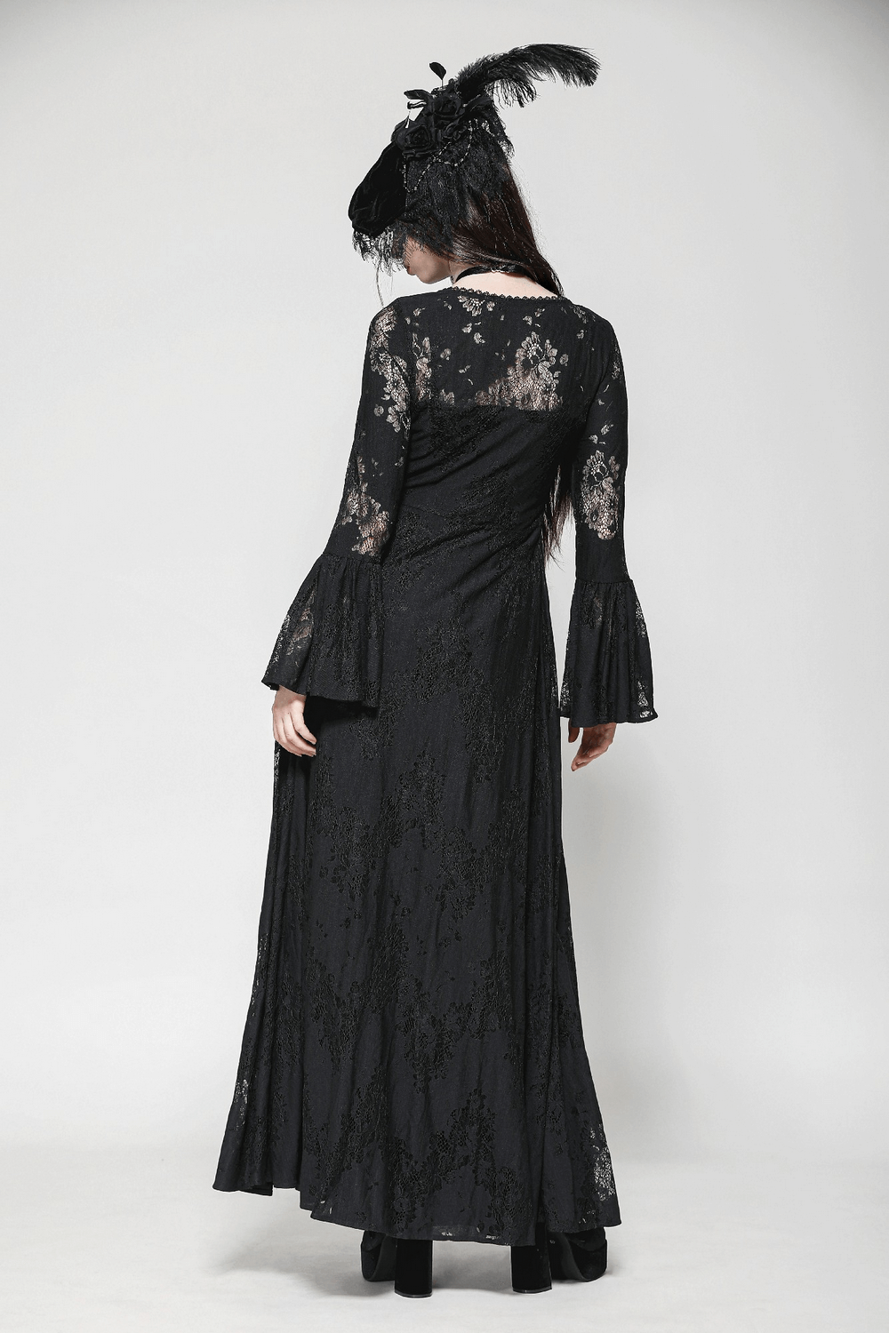 Elegant black lace cape with bell sleeves and floral details, perfect for gothic fashion.