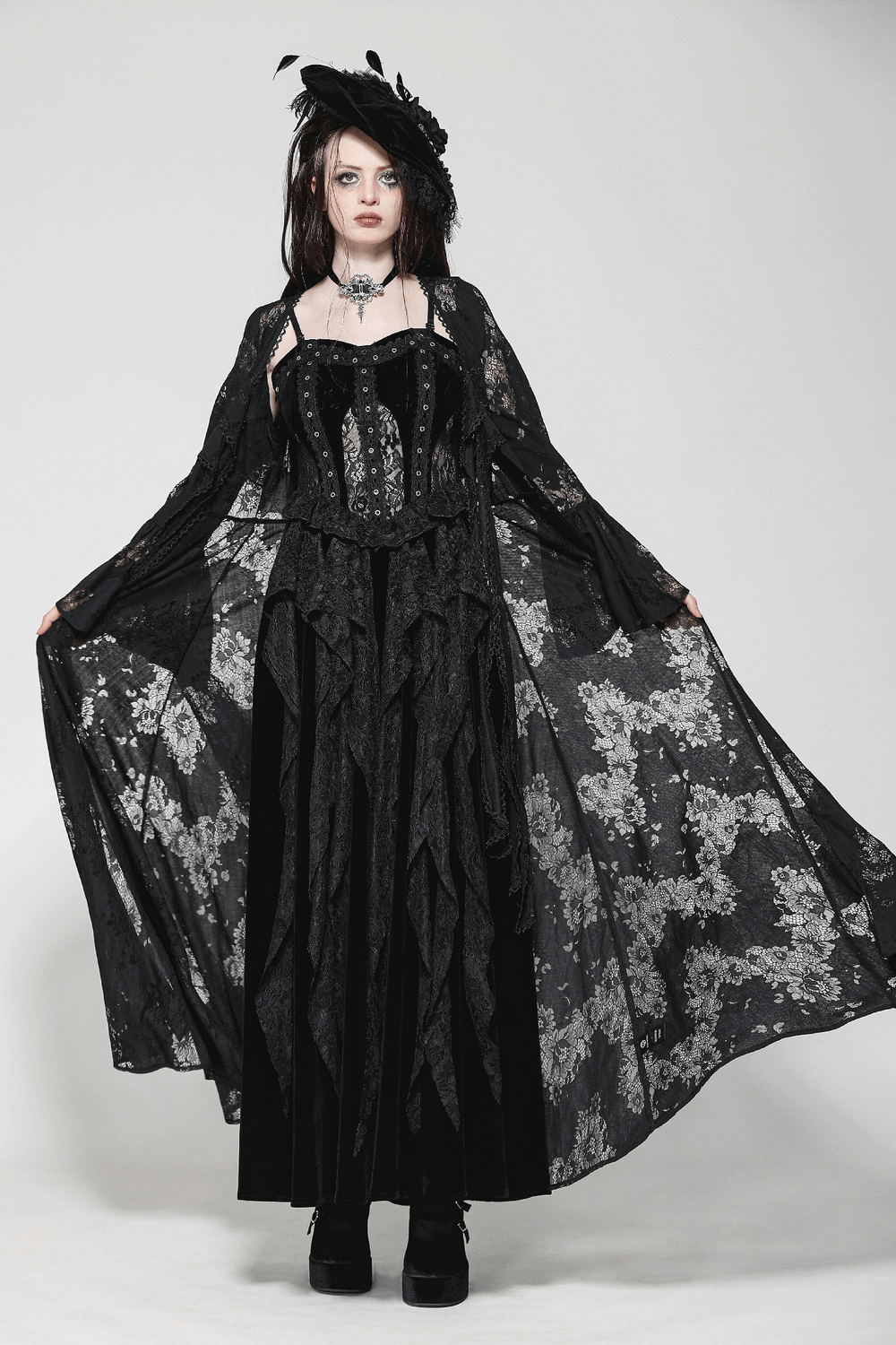 Elegant lace long sleeved cape with floral pattern and bow tie, perfect for gothic and alternative fashion.