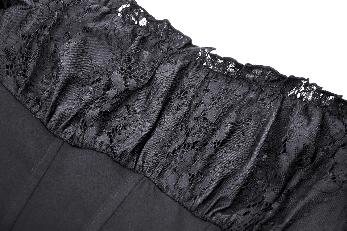 Close-up of black lace detailing on the off-shoulder neckline of a gothic dress.