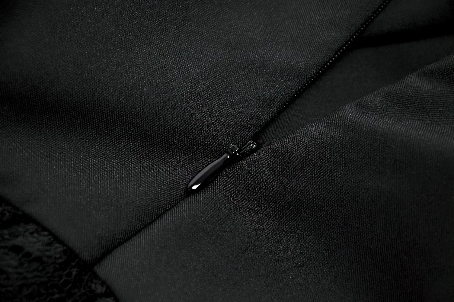 Lace Ruffle Mini Dress with Corset Back and Buckles zipper detail on black fabric background.