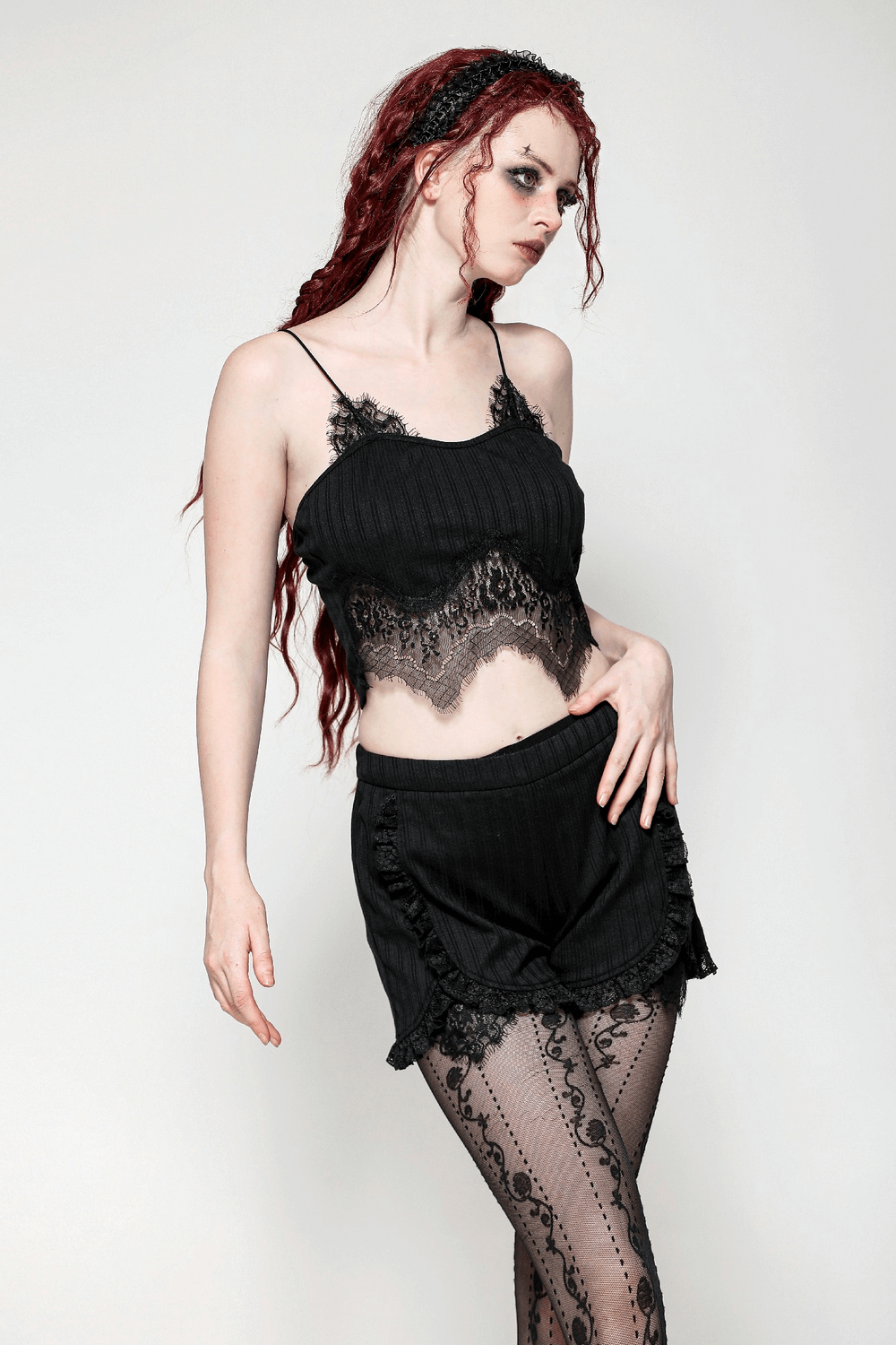 Model showcasing black lace trim ruffle detail high-waist shorts with vintage pinstripe design and matching lace top.