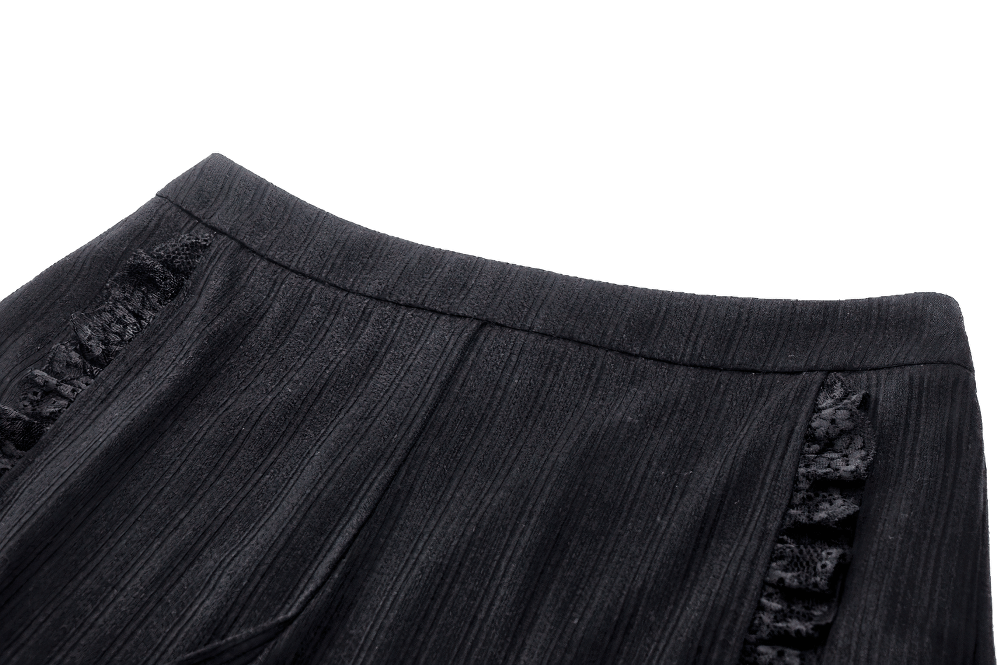 Close-up of vintage-inspired black ruffle detail high-waist shorts with pinstripe design and lace trim.