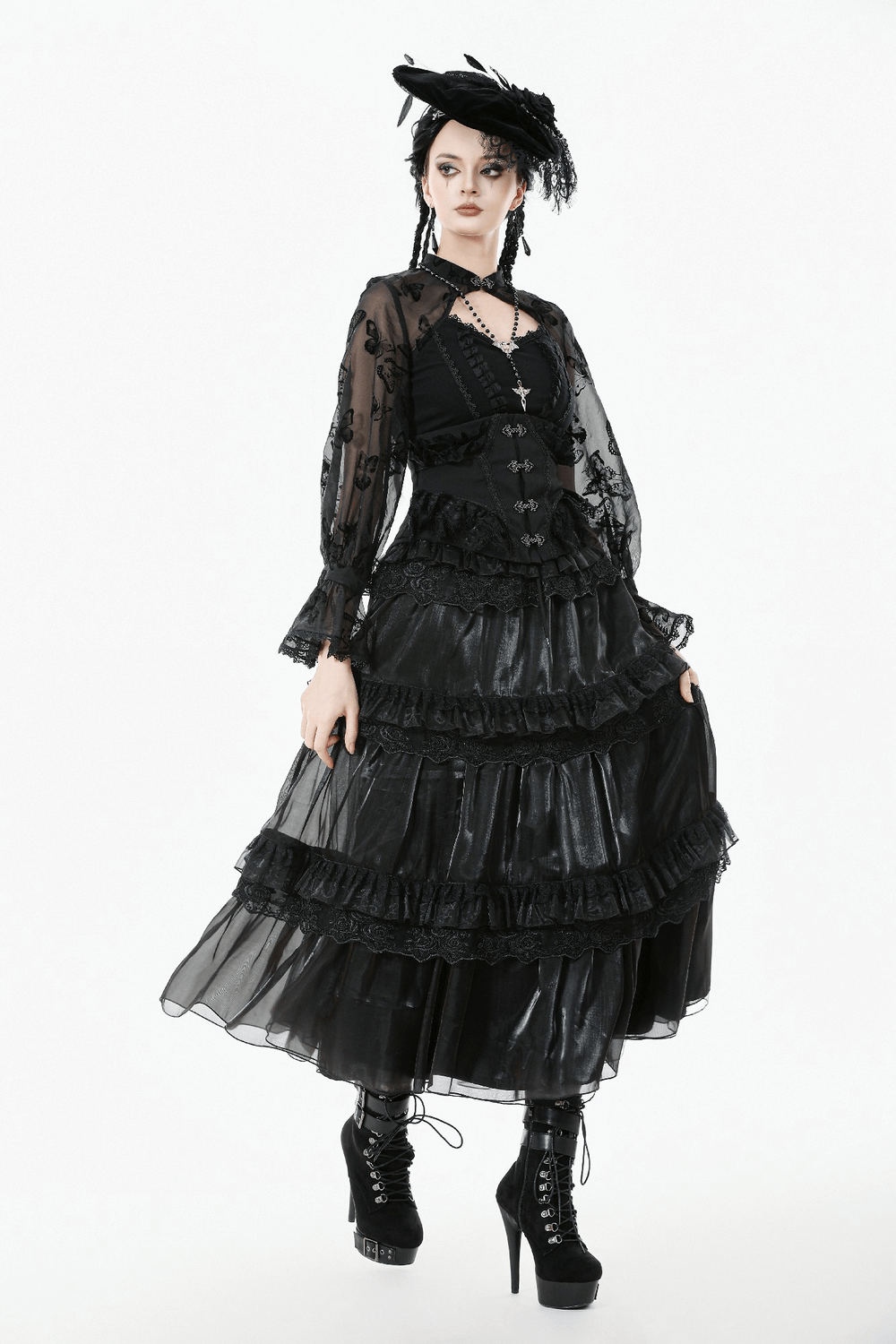 Lace-Trimmed Black Gothic Corset with Front Clasp Closure worn with a flowing black skirt and stylish platform boots.
