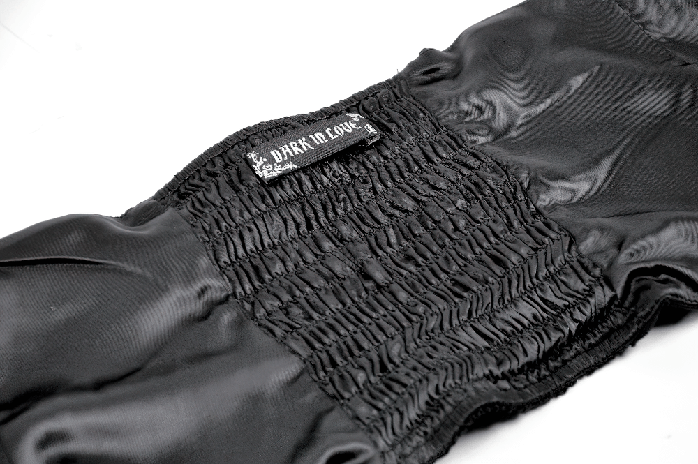 Detail of the Lace-Trimmed Black Gothic Corset with Front Clasp Closure featuring smocked satin fabric and design label.