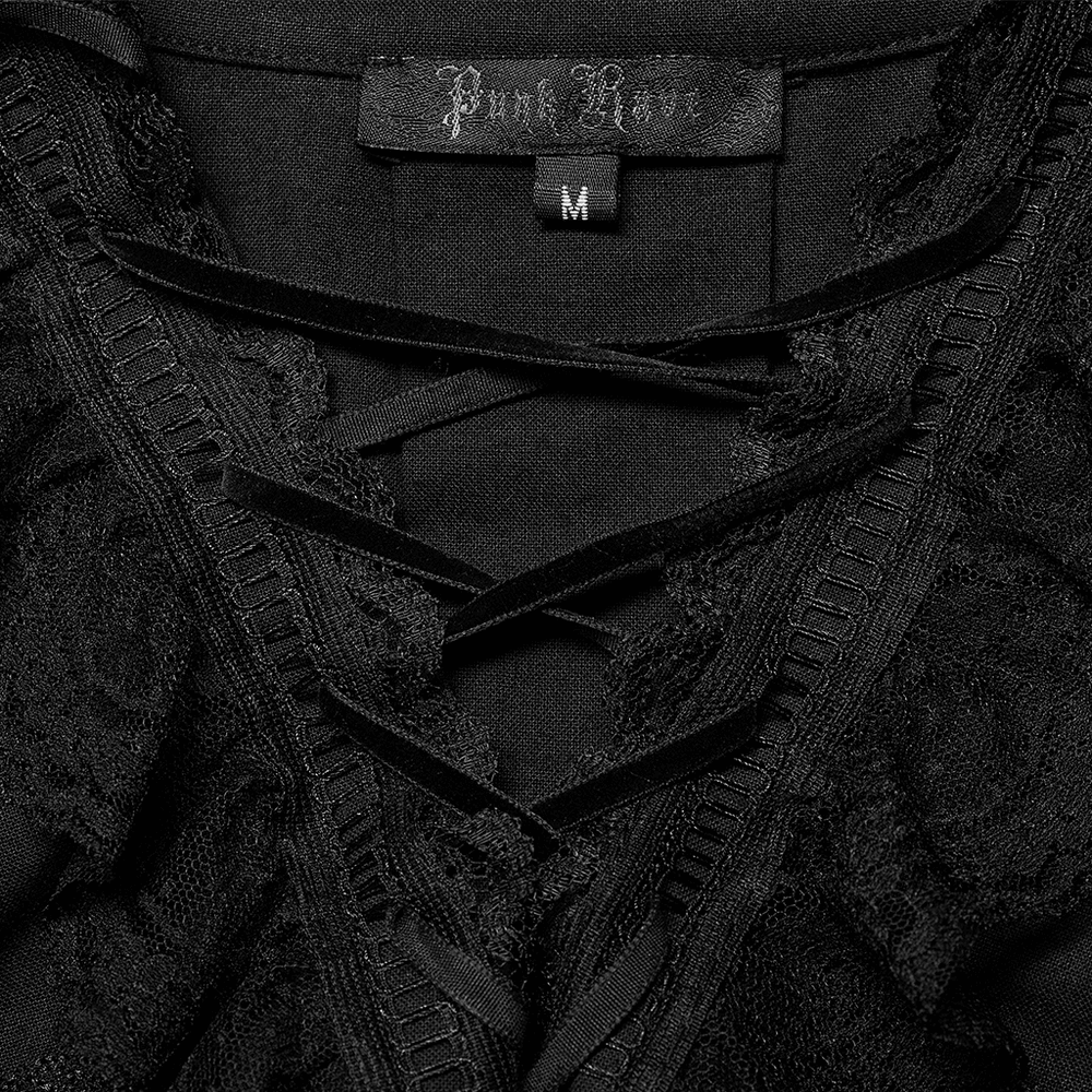 Close-up of the lace-trimmed neckline and tag of a gothic skeleton embroidered shirt in black.