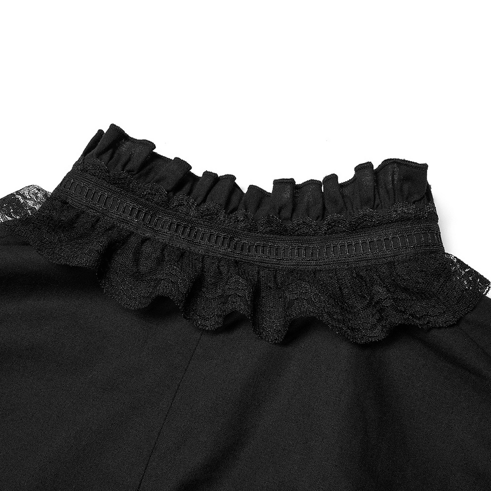 Close-up of the lace-trimmed ruffled neckline on a Gothic skeleton embroidered shirt.