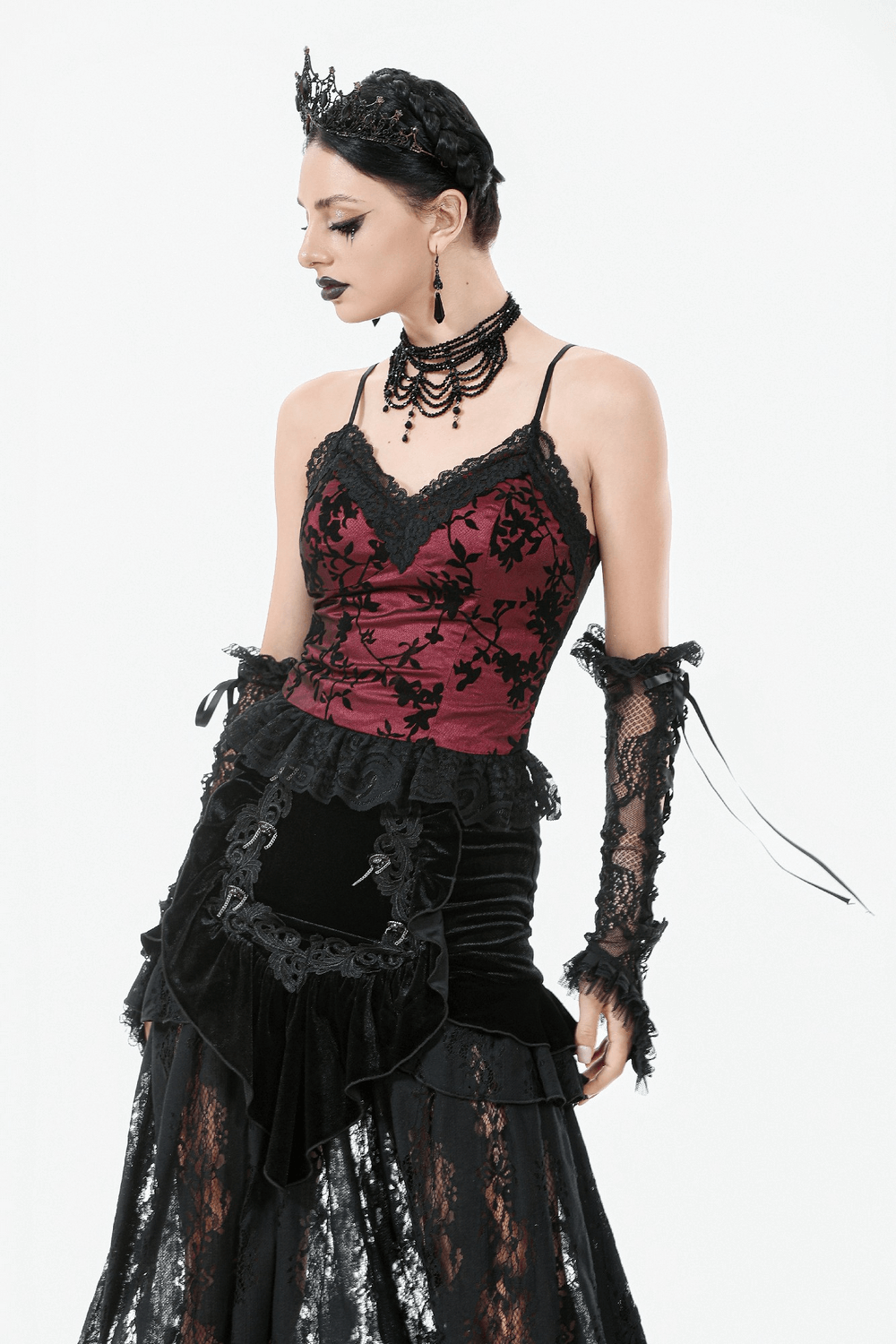 Gothic-inspired off-shoulder satin corset top with lace details and dramatic peplum hem.