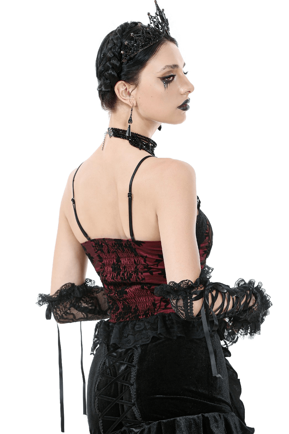 Model wearing a gothic lace-trimmed satin corset top with off-shoulder design and peplum hem, showcasing dramatic style.