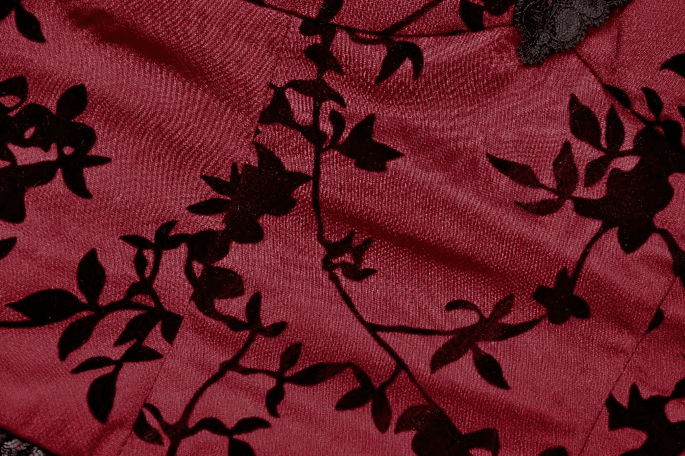 Elegant burgundy satin fabric with black floral lace pattern, perfect for a gothic-inspired corset top.