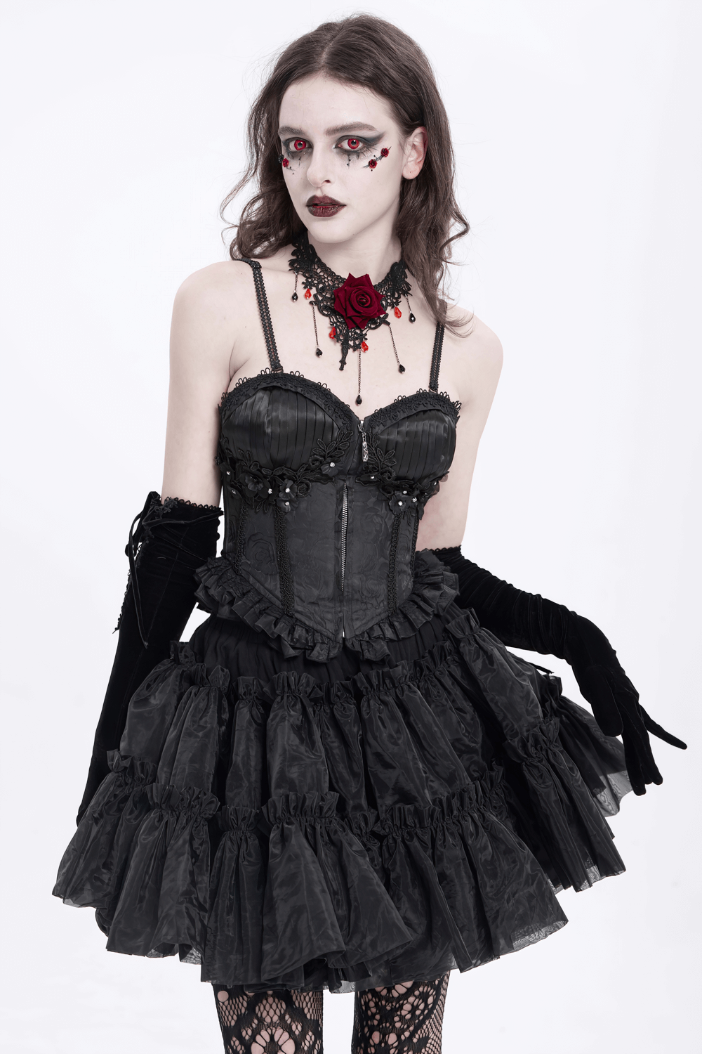 Elegant black corset with floral embellishments and ruffle skirt, styled for a gothic, dramatic look.