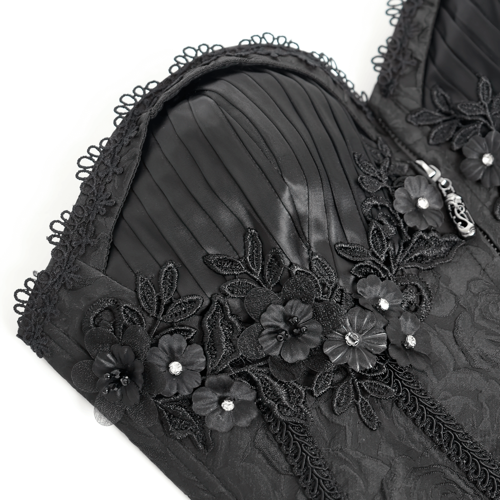 Elegant black floral embellished corset with ruffle detail and intricate lace, perfect for a chic gothic look.