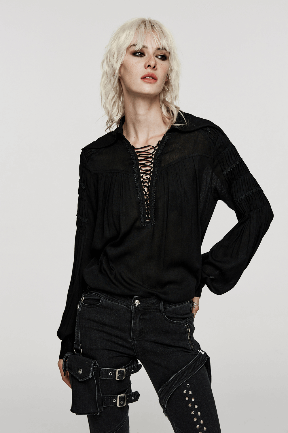 Gothic lace-up blouse with pleated sleeves, featuring a deep V-neck and textured fabric, perfect for edgy fashion.