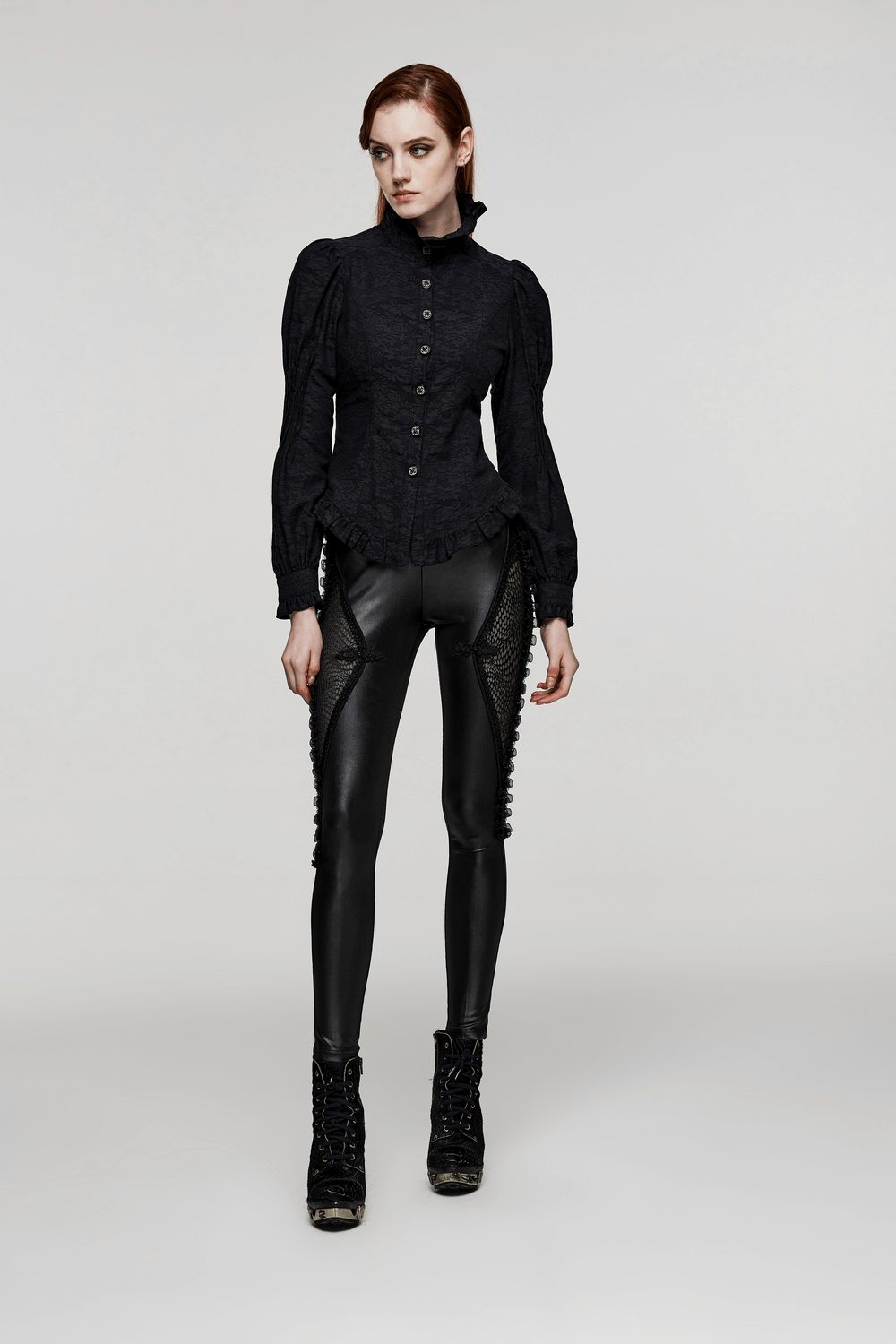 Model showcasing gothic lace-up mesh panel leggings with a chic black blouse, perfect for edgy style.