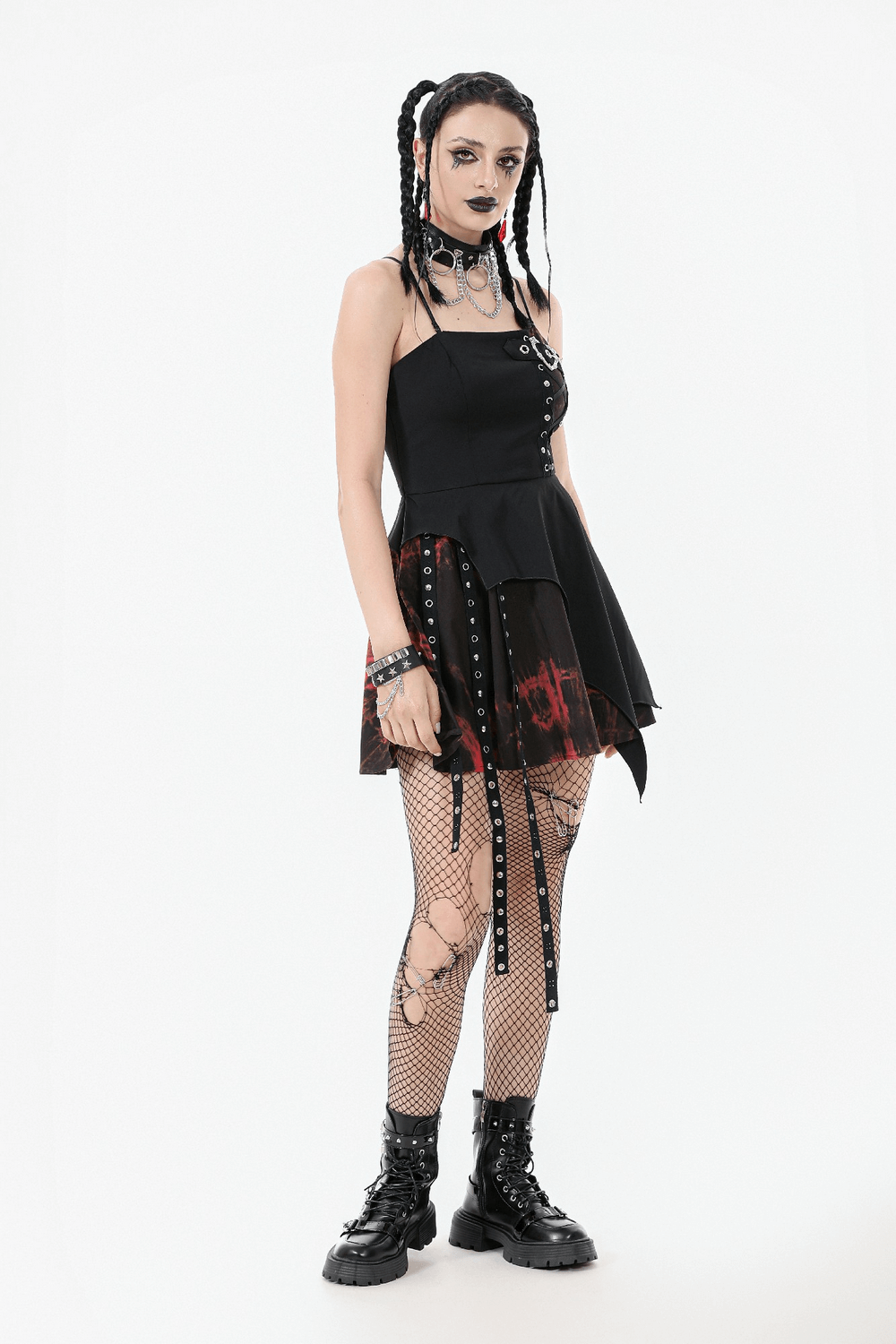 Punk rock-inspired lace-up mini dress with asymmetrical skirt, ribbons, and fishnet stockings for alternative fashion.