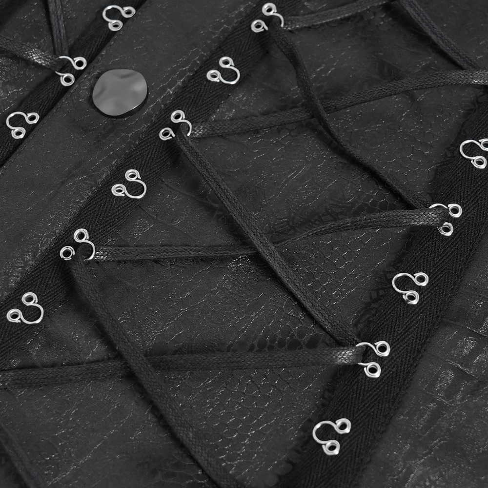 Close-up of black lace-up shirt featuring metal buttons and epaulets, showcasing intricate detailing and texture.