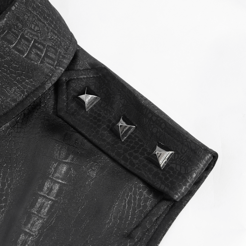 Close-up of a black lace-up sleeveless shirt showcasing epaulets and metal buttons for a stylish touch.