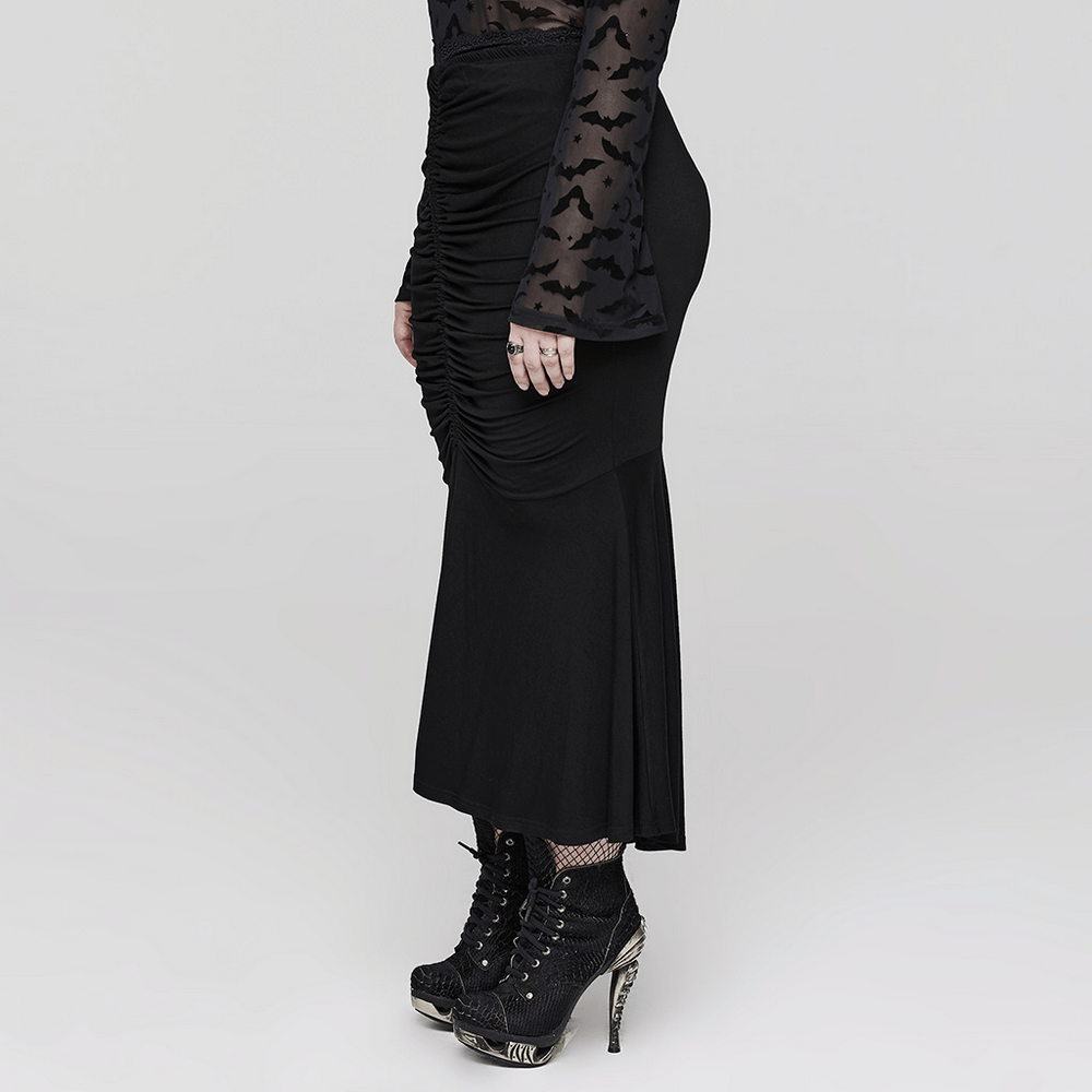 Side view of a chic Goth slim fit fishtail skirt with elegant ruching, paired with stylish lace-up boots.