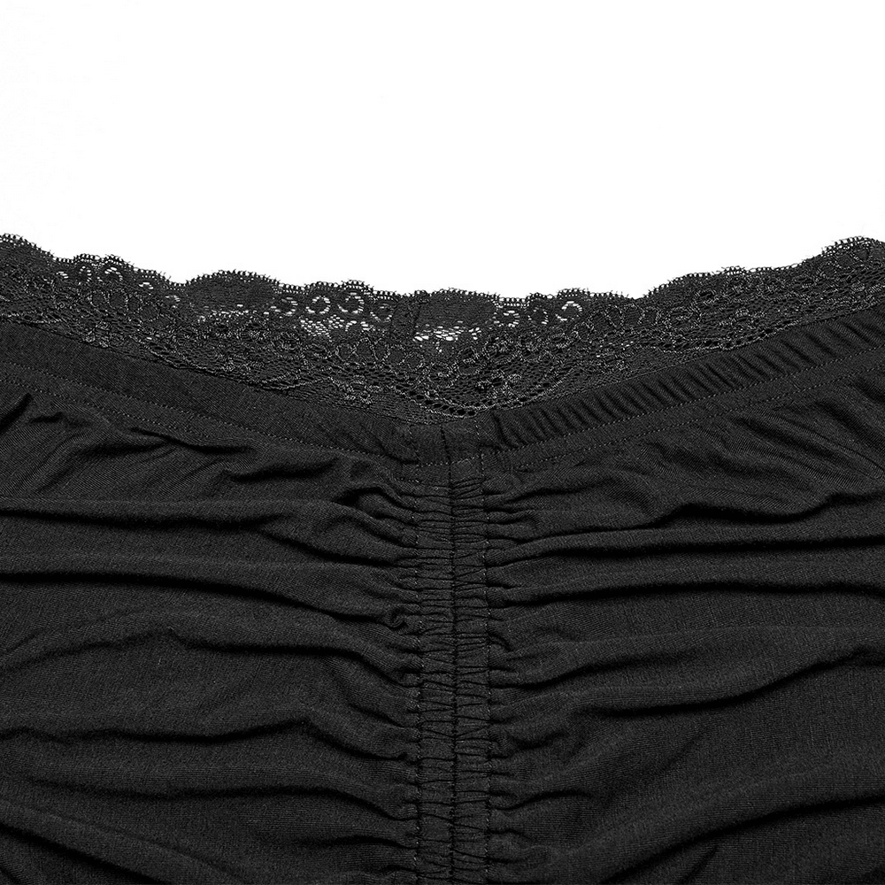 Close-up of lace waistline on a chic black modal fishtail skirt, showcasing elegant ruching and delicate design.