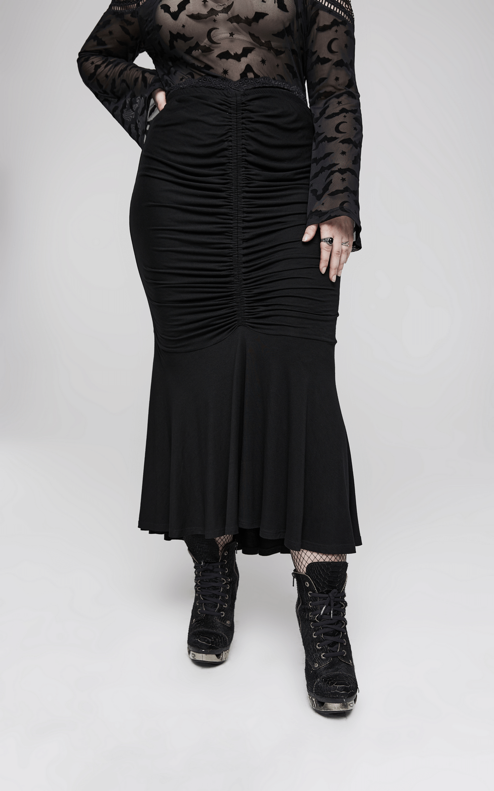 Elegant lace-waist modal fishtail skirt, highlighting curves, paired with edgy black boots for a chic goth vibe.