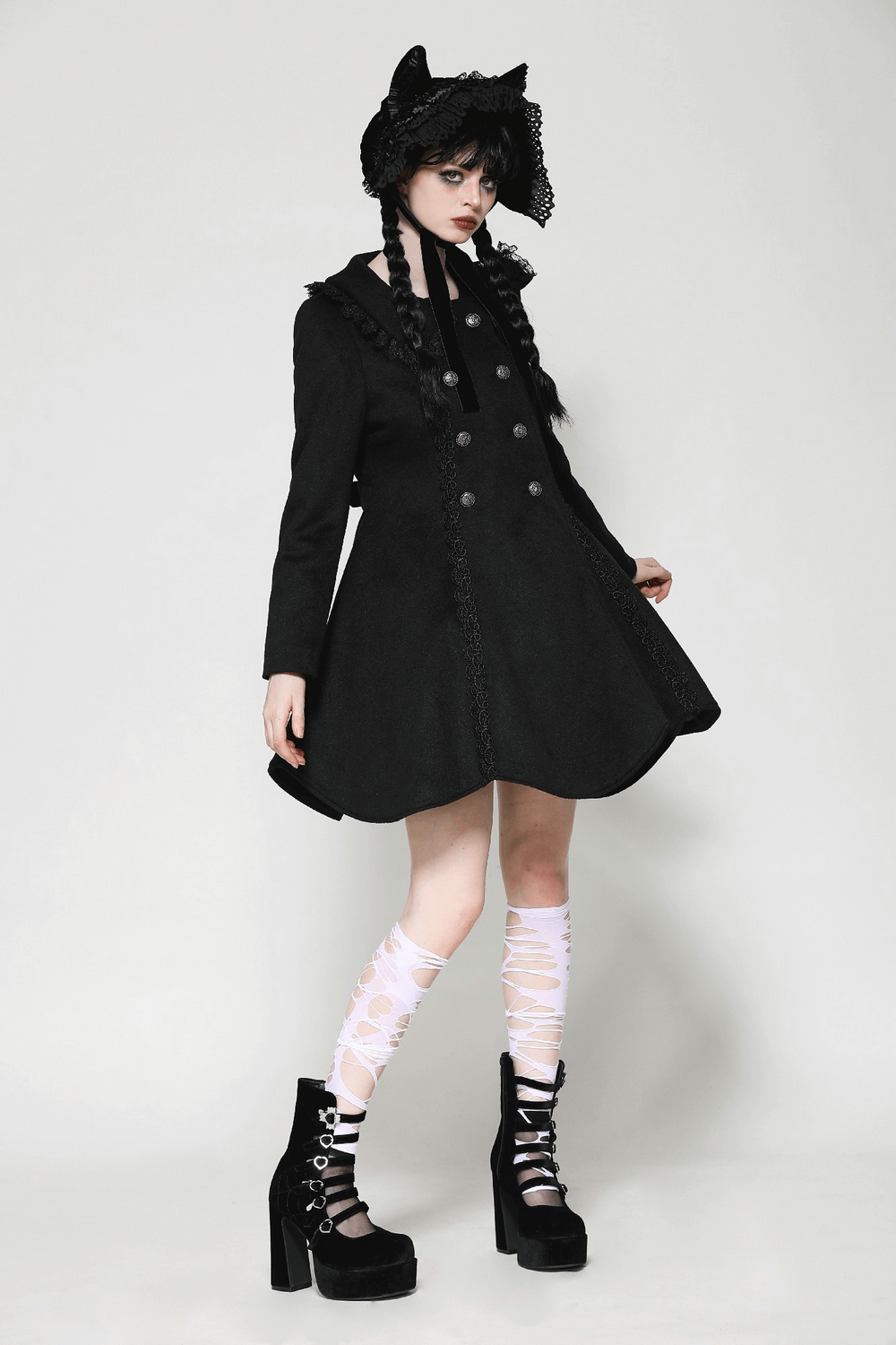 Elegant ladies black Victorian style coat with lace trim, paired with stylish accessories and striking heels.