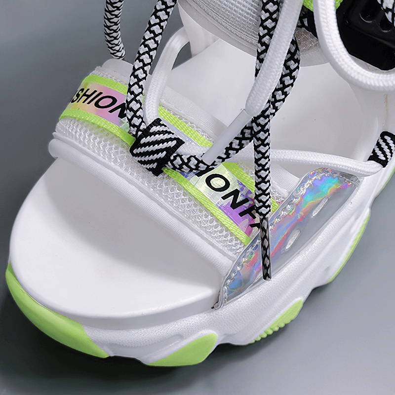 Close-up of ladies chunky platform sandals with buckle strap, featuring vibrant mixed colors and stylish design.