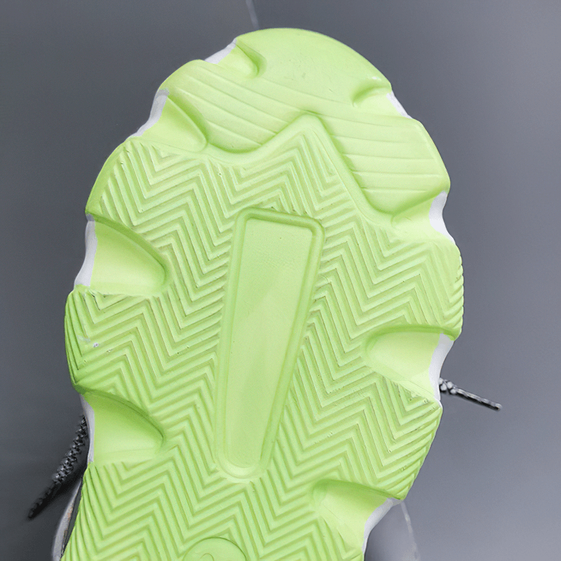 Sole of ladies chunky platform sandals featuring vibrant green rubber with textured grip for comfort and style.