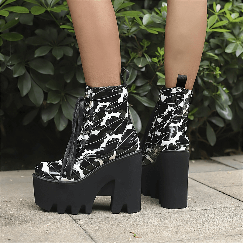 Ladies goth platform ankle boots with striking bat print and thick high heels, perfect for adventurous fashion lovers.