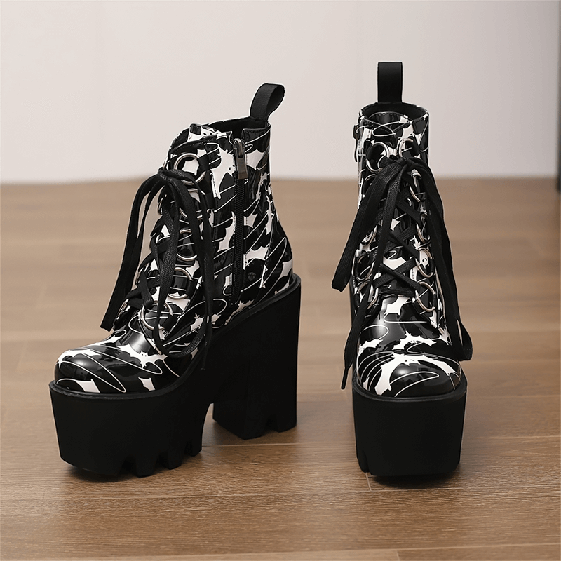 Ladies goth platform ankle boots with bat print, featuring thick heels and stylish lace-up design.