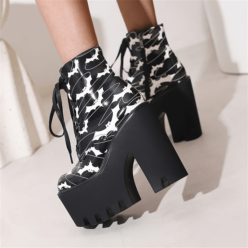 Ladies goth platform ankle boots with striking bat print and thick high heels for a bold fashion statement.