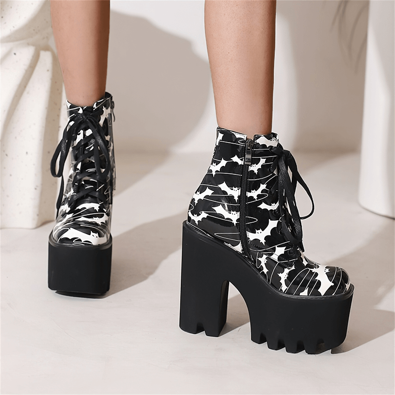 Ladies goth platform ankle boots with bat print, black thick high heels, perfect for a daring fashion statement.