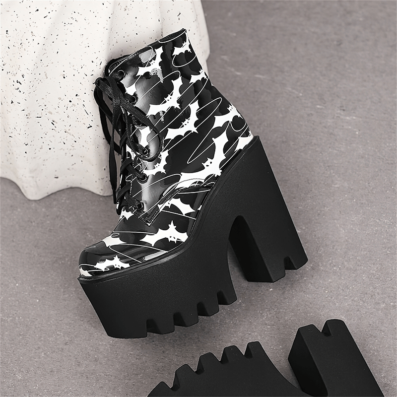 Ladies goth platform ankle boots with bat print, featuring thick high heels for bold gothic style.
