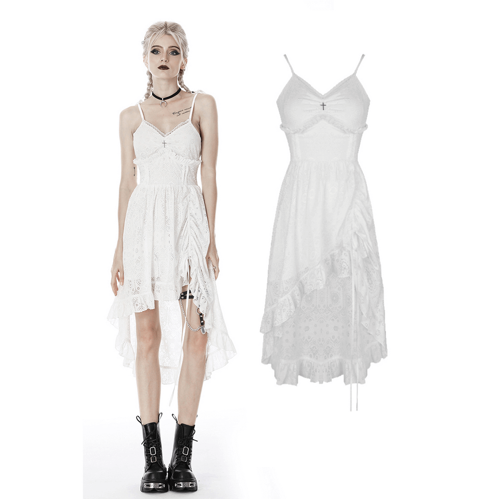 Ladies white lace midi dress with asymmetric hem and gothic details, styled with bold black boots.