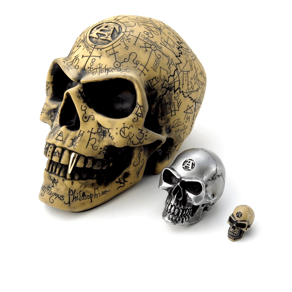 Tiny and large Lapillus skulls with mystical symbols for gothic and occult decor, perfect as worry stones.