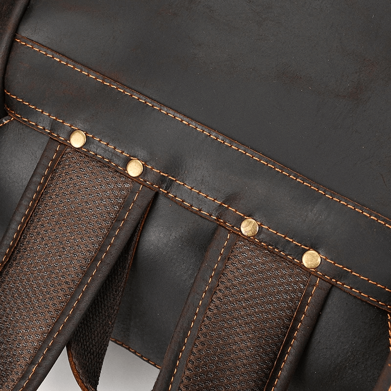 Close-up of the sturdy straps and stitching on a genuine leather unisex backpack.