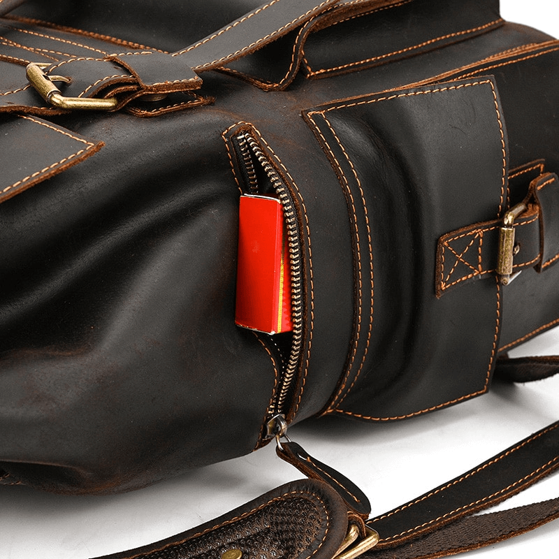 Genuine leather laptop travel backpack with multiple pockets and a vibrant zipper pull.