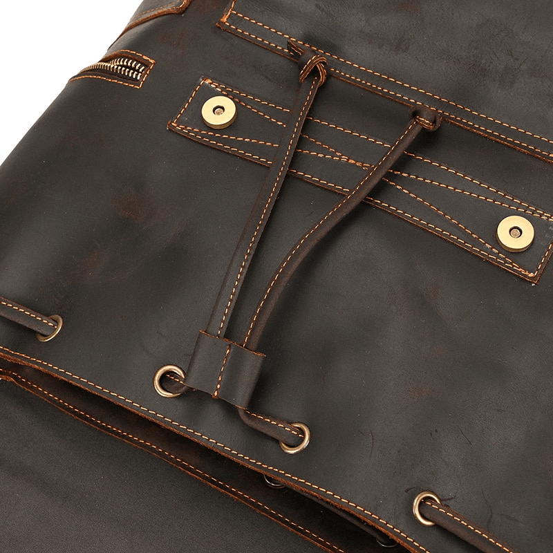 Close-up of a large genuine leather backpack showcasing pockets and drawstring, perfect for travel and organization.