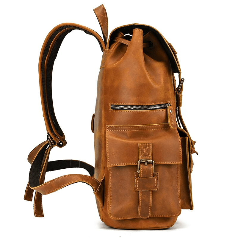 Side view of a large genuine leather laptop travel backpack with multiple pockets, perfect for organization and style.