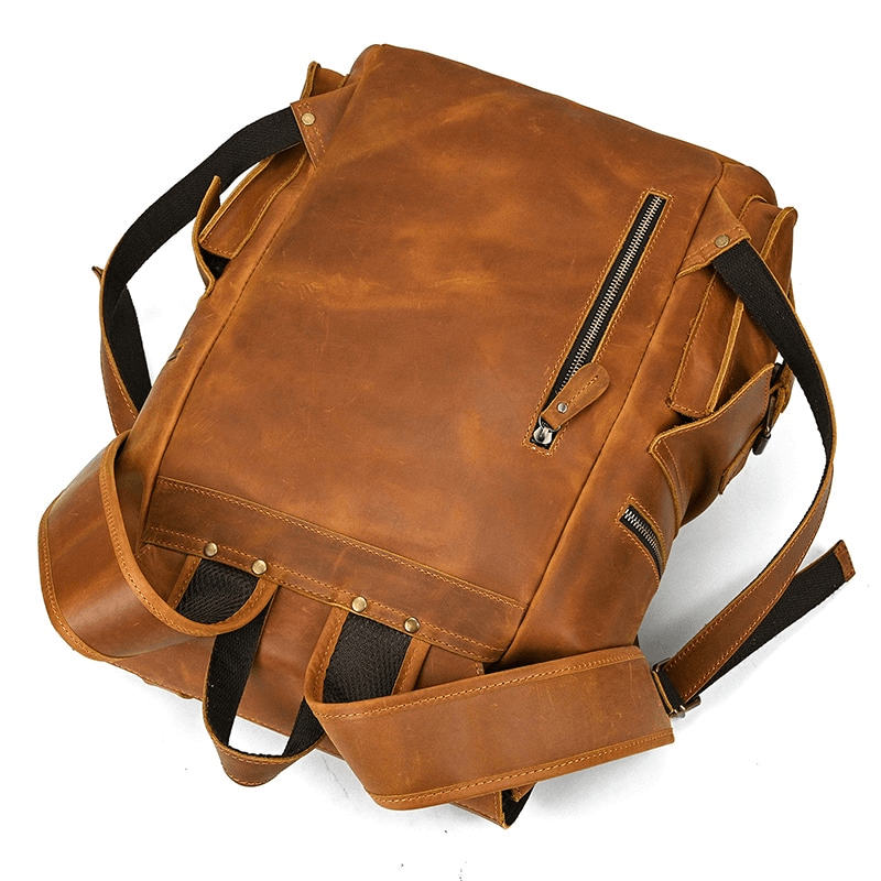 Stylish large genuine leather laptop travel backpack with multiple pockets, perfect for unisex casual look.