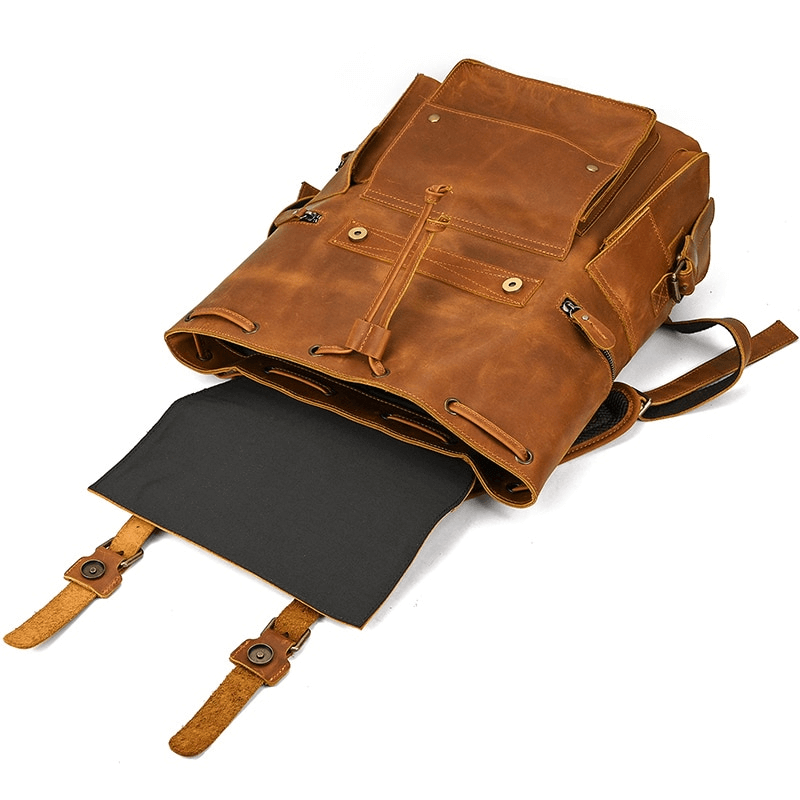 Large genuine leather unisex travel backpack with many pockets, ideal for laptops and daily essentials.