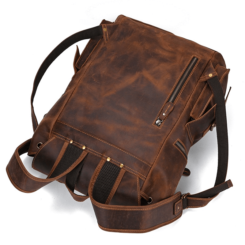 Stylish large genuine leather laptop backpack featuring multiple pockets and adjustable straps for versatile travel.