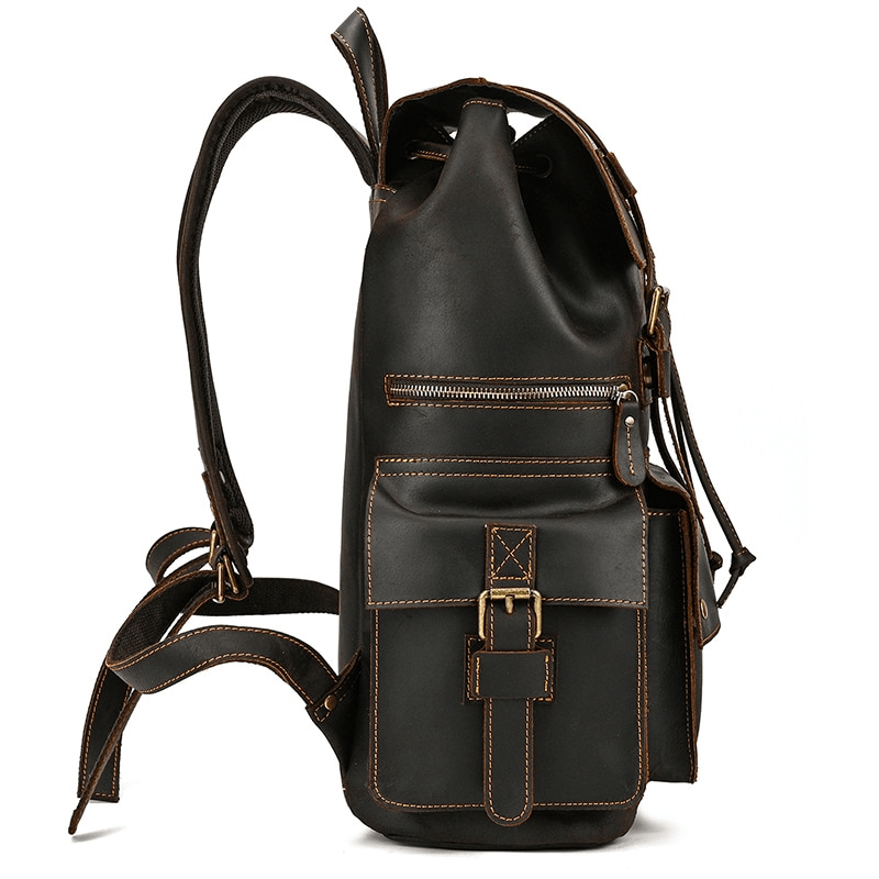 Stylish unisex genuine leather laptop backpack with multiple pockets and casual design.