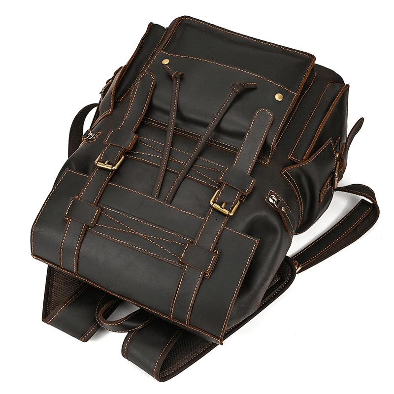 Large genuine leather unisex backpack with multiple pockets and stylish design for travel and daily use.