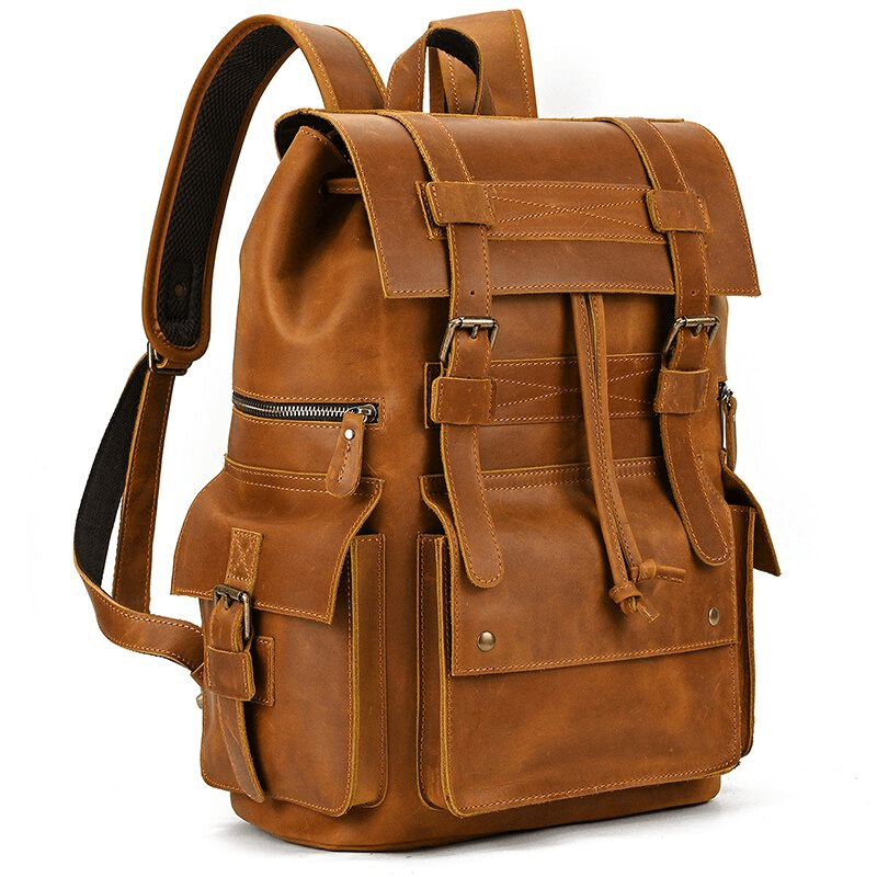 Large genuine leather unisex backpack with multiple pockets for travel and everyday use.