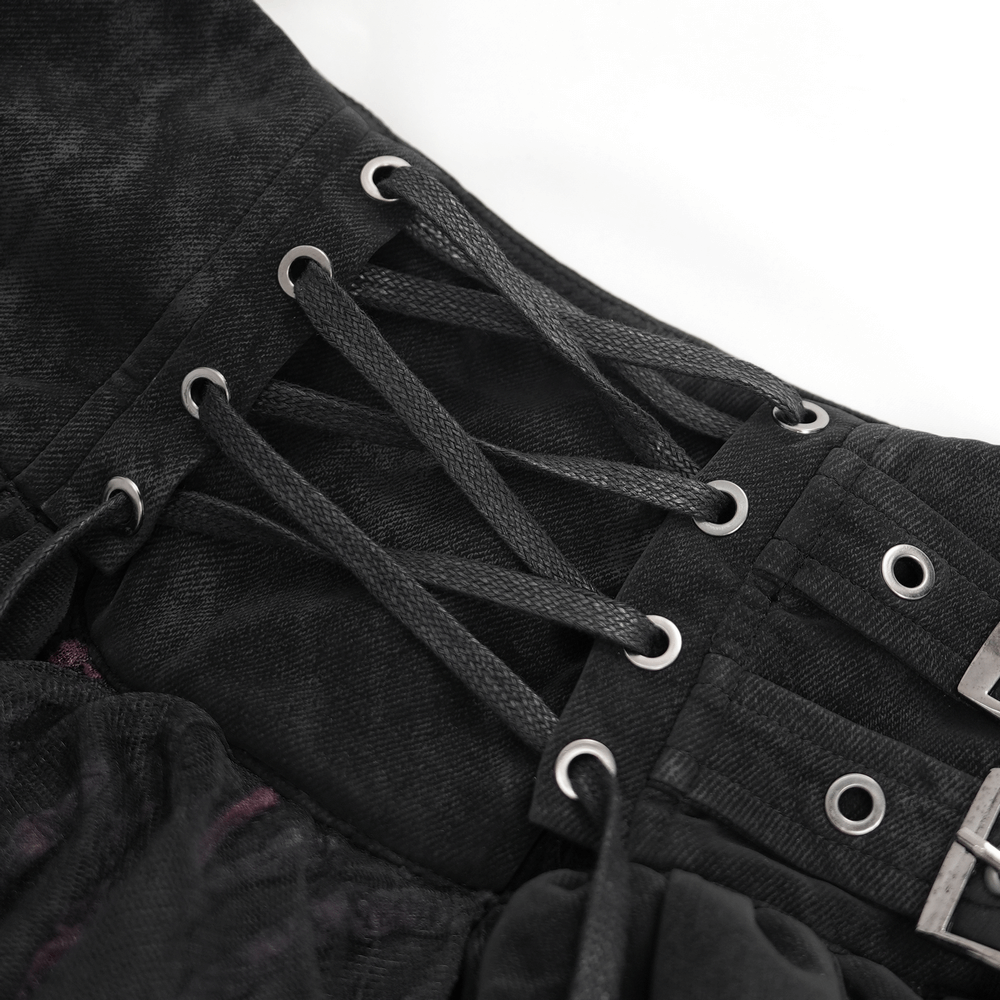 Close-up of the adjustable lacing on a gothic skirt, showcasing black lace details and edgy buckle accents.