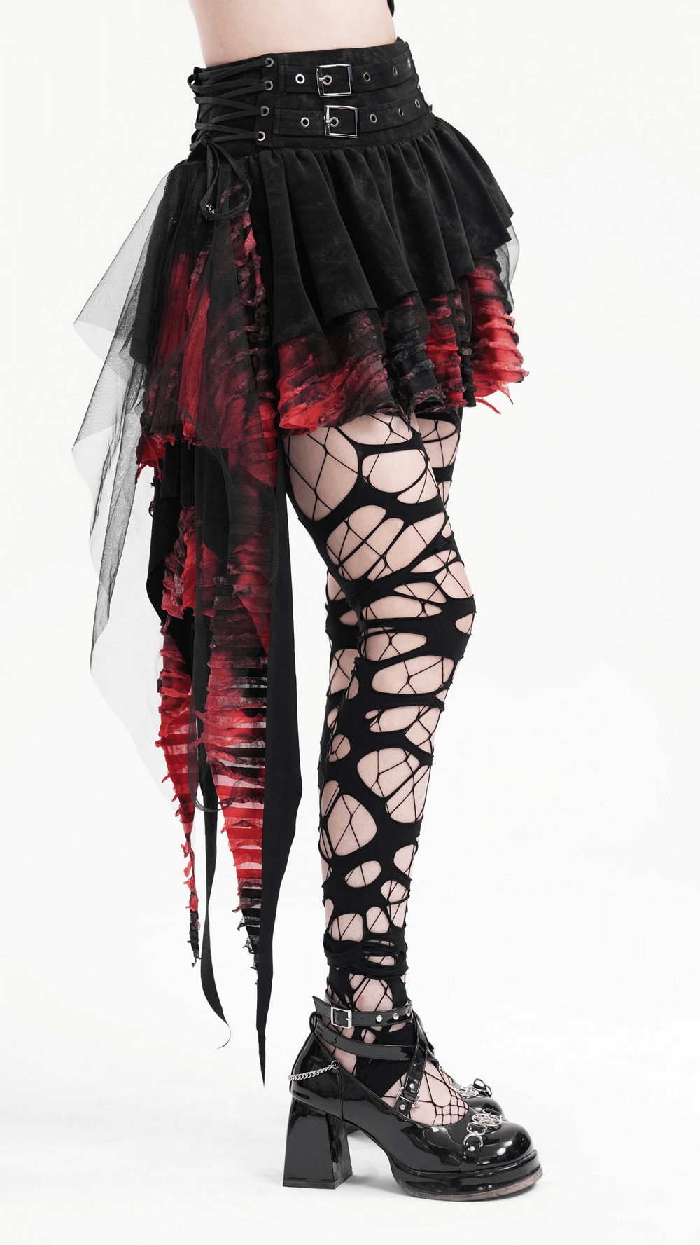 Layered asymmetrical gothic skirt in red and black with lace and tulle, styled with edgy fishnet leggings and chunky boots.