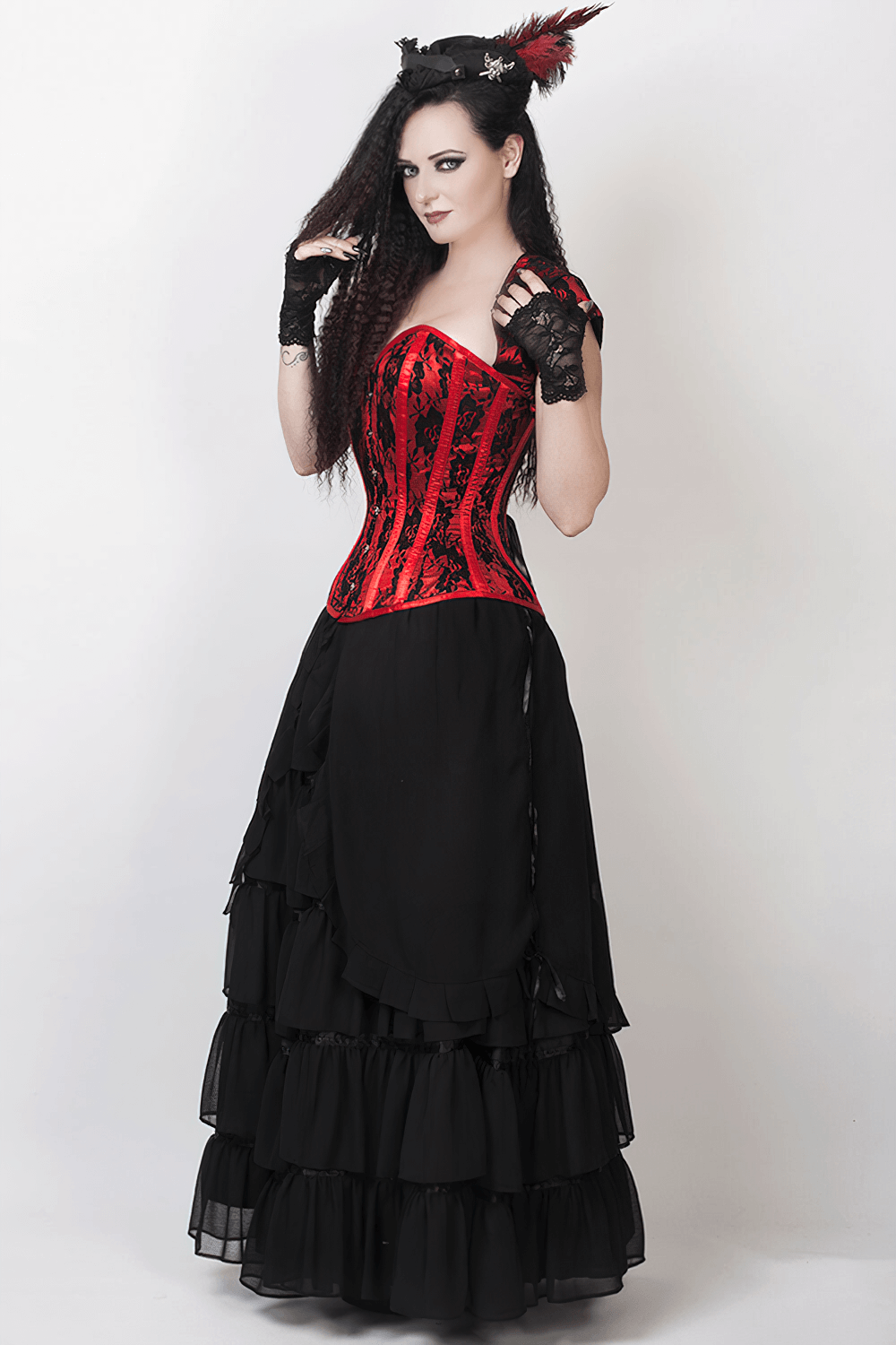 Model wearing a stunning black Victorian maxi skirt paired with a striking red corset, showcasing elegant gothic style.