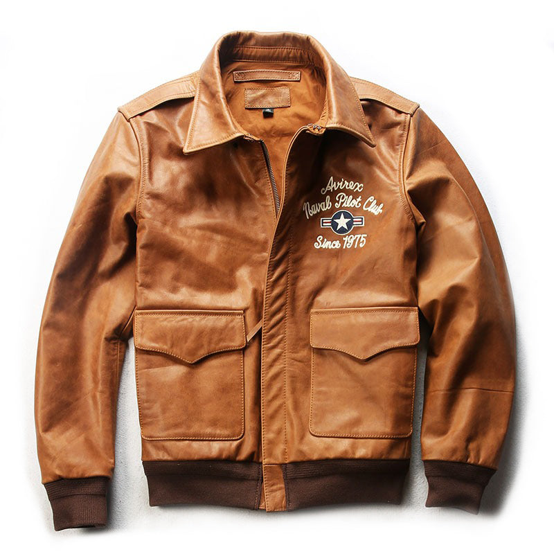 Men's leather bomber jacket in brown with vintage patches, ideal for a rock style outfit.