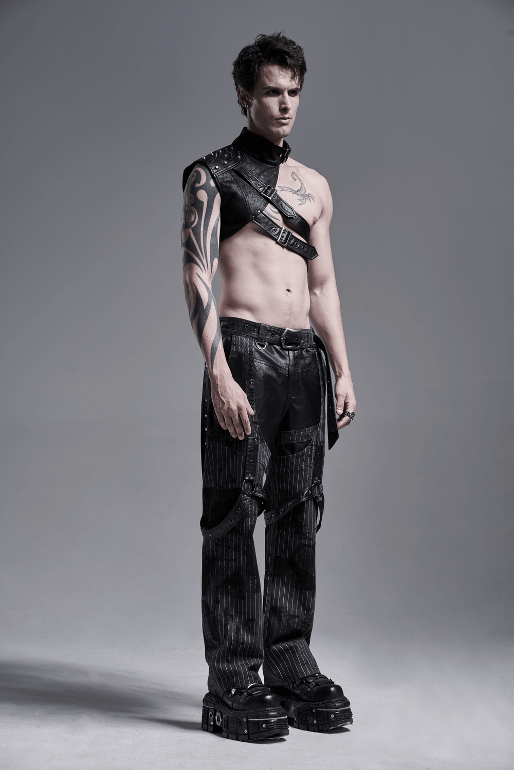 Punk men's one-arm leather shoulder harness, showcasing edgy style with bold metal rivets and textured design.